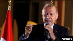 FILE PHOTO: Turkish President Tayyip Erdogan addresses supporters in Ankara after the second round of the presidential election